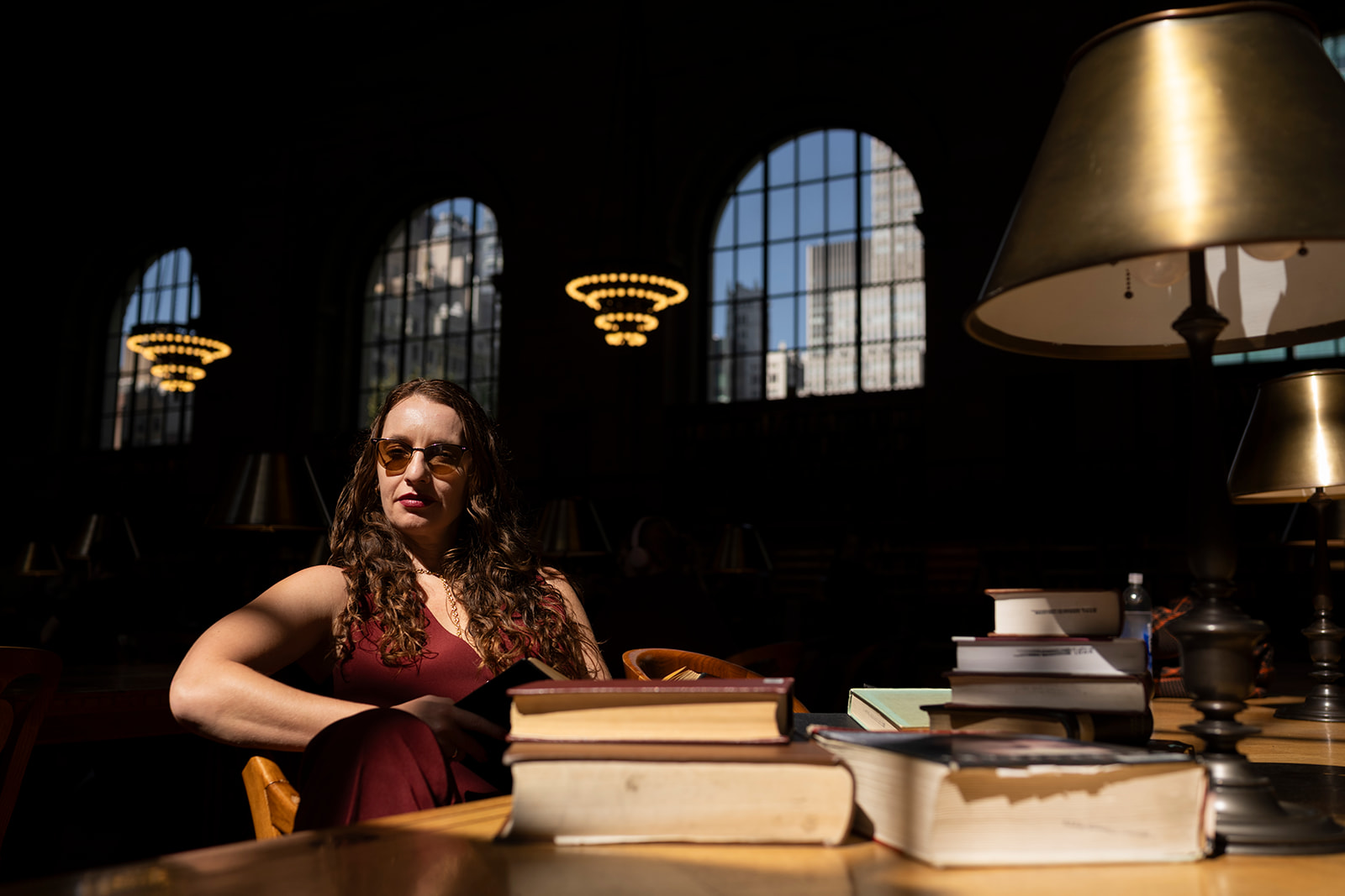 Tam Gryn reading in the dark library